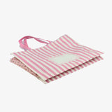 粉色柔和立體袋，攤平。