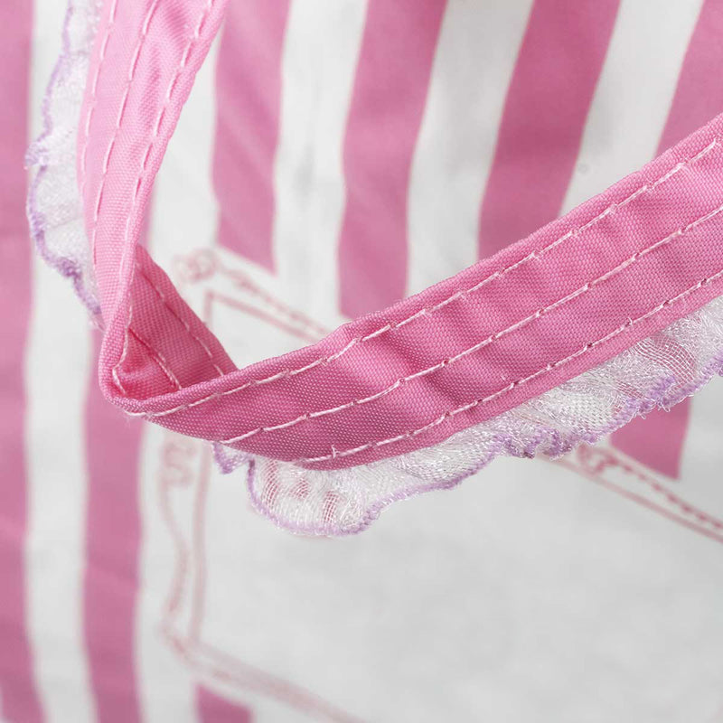 粉色柔和立體袋，提袋手把特寫。