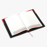 黑紅鬆緊帶封套工商日誌，斜角特寫